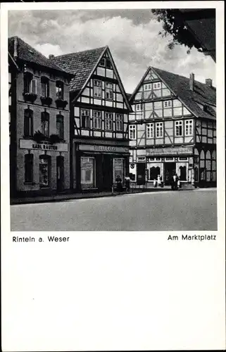 Ak Rinteln an der Weser Kreis Schaumburg, Am Marktplatz, Geschäft Karl Rauter, Fachwerkhäuser