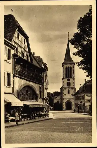 Ak Munster Münster Elsass Haut Rhin, La Rue de l'Eglise, Kirche, Grand Bazar, Geschäftshaus