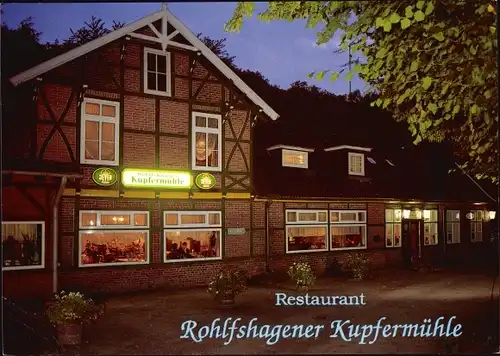 Ak Tremsbüttel in Schleswig Holstein, Restaurant Wolfshagener Kupfermühle, Außenansicht, Beleuchtung
