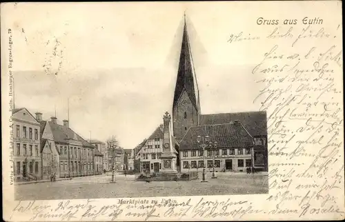 Ak Eutin in Ostholstein, Häuserpartie am Marktplatz mit Kirche