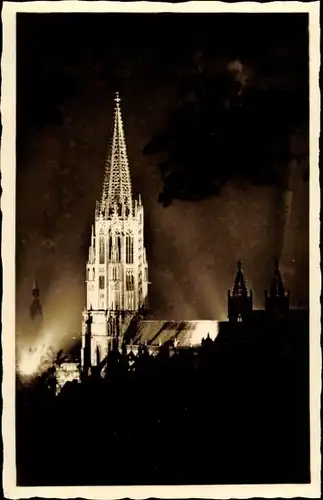 Ak Freiburg im Breisgau, Münster in festlicher Beleuchtung bei Nacht
