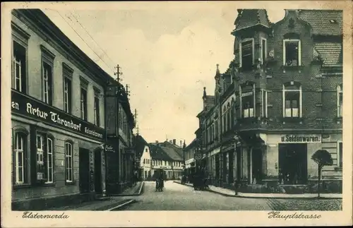 Ak Elsterwerda in Brandenburg, Hauptstraße, Kolonialwarenhandlung Artur Thrandorf, Geschäfte