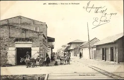 Ak Rufisque Senegal, Une Rue, Straßenpartie, Wohngebäude, Stall, Esel