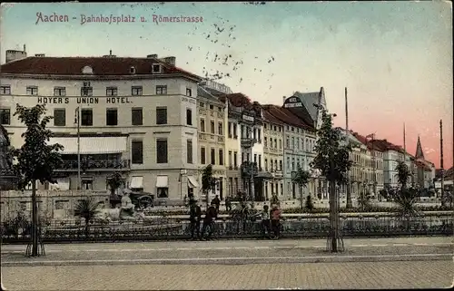 Ak Aachen in Nordrhein Westfalen, Bahnhofsplatz und Römerstraße