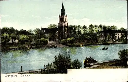 Ak Lidköping Schweden, Flusspartie mit Blick auf die Kirche