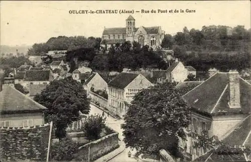 Ak Oulchy le Chateau Aisne, Rue du Pont et de la Gare, eglise