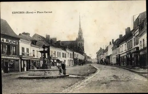 Ak Conches Eure, Place Carnot, Brunnen, Geschäfte