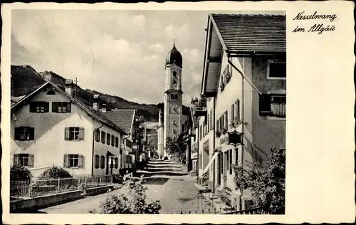 Ak Nesselwang im Allgäu, Straßenpartie mit Kirche