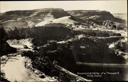 Ak Drummond Natal Südafrika, Castle of a Thousand Hills, mountain road, car, power line