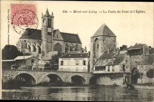 Ak Moret-sur-Loing Seine et Marne, La Porte du Pont et l'Eglise, Epicerie Mercerie