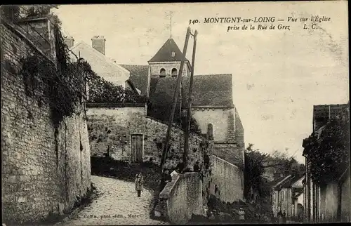 Ak Montigny sur Loing Seine et Marne, prise de la Rue de Gerz, vue sur Eglise