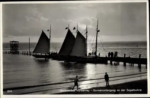 Ak Norderney in Ostfriesland, Sonnenuntergang an der Segelbuhne, Segelboot