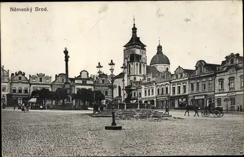 Ak Havlíčkův Brod Německý Brod Havlíčkův Brod in Ostböhmen, Marktplatz, Kirche Mariä Himmelfahrt