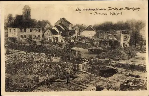 Ak Domnowo Domnau Ostpreußen, Das niedergebrannte Viertel am Marktplatz, Kriegszerstörungen, WK I