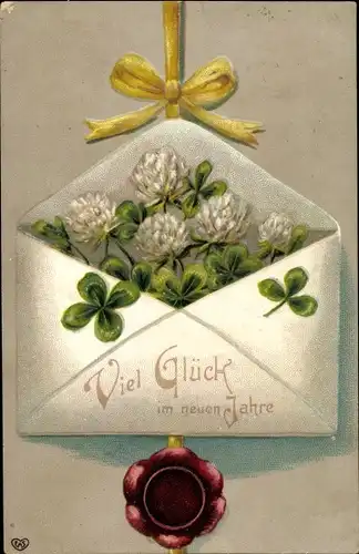 Ak Glückwunsch Neujahr, Kleeblätter in einem Briefumschlag
