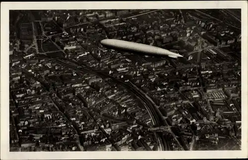 Ak Wien, Luftschiff LZ 127 Graf Zeppelin über der Stadt, Fliegeraufnahme
