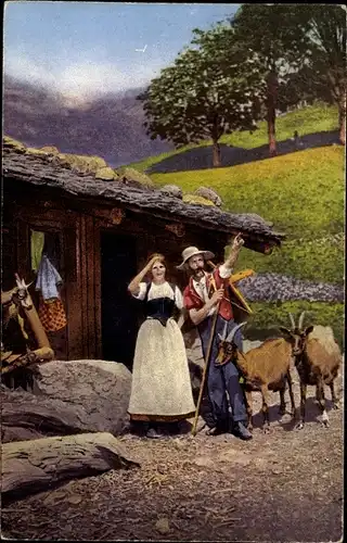 Ak Ehepaar in schweizerischer Tracht, Ziegen, Dorfbild