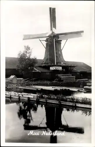 Ak Mooi Niederlande, Ortspartie mit Windmühle