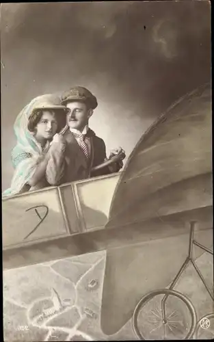 Ak Mann und Frau in einem Flugzeug, Fotomontage
