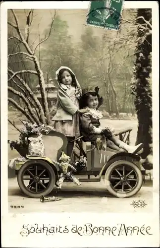 Ak Glückwunsch Neujahr, Junge und Mädchen in einem Automobil, Puppe
