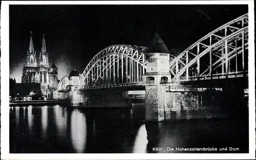 Ak Köln am Rhein, Stadt im Scheinwerferlicht, Dom, Hohenzollernbrücke