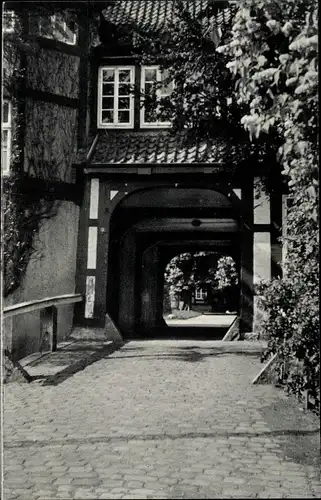 Ak Syke in Niedersachsen, Wegpartie am Kreishaus Tor, Fachwerkgebäude