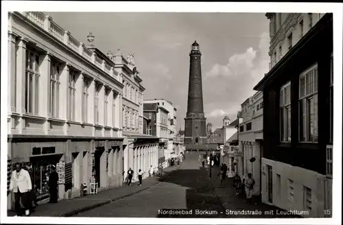 Ak Insel Borkum im Kreis Leer, Strandstrasse mit Leuchtturm