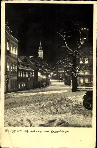 Ak Schneeberg im Erzgebirge, Straßenpartie, Winter, Nacht