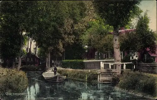 Ak Giethoorn Overijssel Niederlande, Flusspartie, Ruderboot, Mann mit Kind