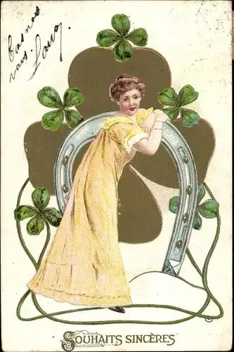 Präge Litho Souhaits Sinceres, Glückwunsch, Frau im gelben Kleid, Hufeisen, Kleeblätter