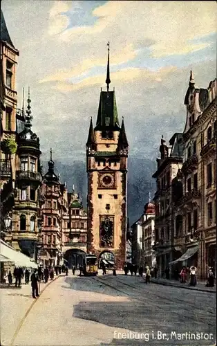 Künstler Ak Freiburg im Breisgau, Blick zum Martinstor, Straßenbahn