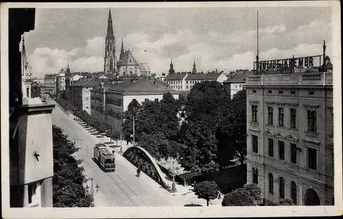 Ak Olomouc Olmütz Stadt, Teilansicht, Kirche, Haus Julius Kremer, Straßenbahn