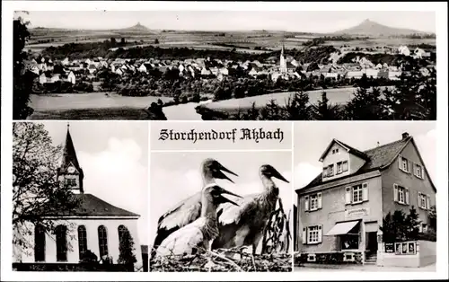 Ak Atzbach Lahnau in Hessen, Totalansicht, Störche, Kirche, Geschäft