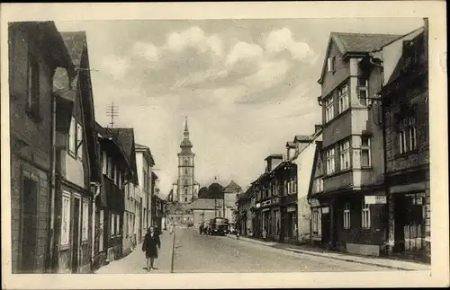 Ak Mimoň Niemes Region Reichenberg, Straßenpartie, Kirche