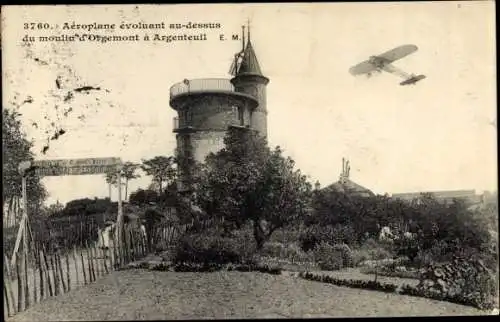 Ak Argenteuil Val d´Oise, Aeroplane evoluant au dessus du moulin d'Orgemont