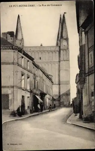 Ak Le Puy Notre Dame Maine et Loire, L'Eglise, La Rue du Commerce