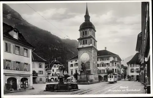 Ak Altdorf Kt. Uri Schweiz, Hauptplatz, Wilhelm Tell Denkmal, Straßenbahn