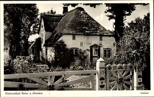 Ak Nebel auf der Insel Amrum Nordfriesland, Haus mit Garten, Reetdach