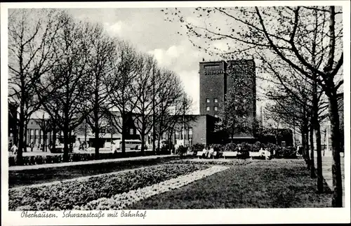 Ak Oberhausen im Ruhrgebiet, Schwarzstraße mit Bahnhof