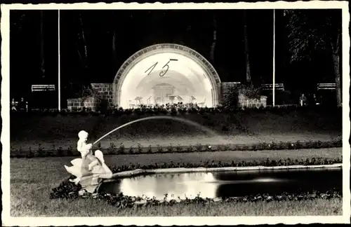 Ak Polczyn Zdrój Bad Polzin Pommern, Abendbeleuchtung am Konzertplatz