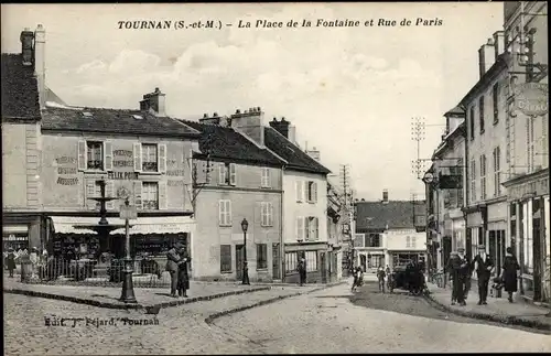 Ak Tournan Seine et Marne, La Place de la Fontaine, Rue de Paris