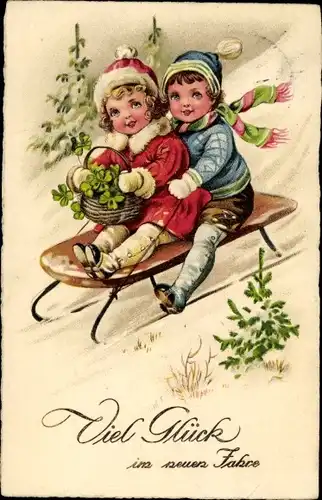 Ak Glückwunsch Neujahr, Kinder auf einem Schlitten, Kleeblätter