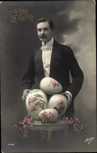Ak Glückwunsch Ostern, Mann mit Ostereiern