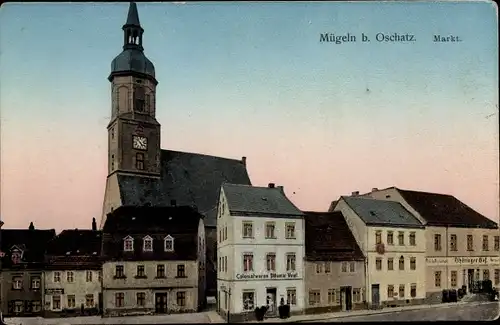 Ak Mügeln bei Oschatz in Sachsen, Markt, Kolonialwaren Voigt, Kirche