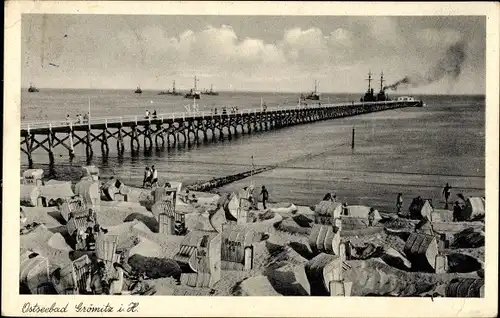 Ak Ostseebad Grömitz in Holstein, Strand mit Seebrücke