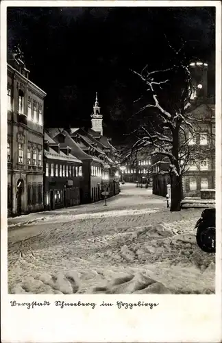 Ak Schneeberg im Erzgebirge Sachsen, Straßenpartie, Winter, Nacht