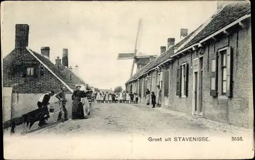 Ak Stavenisse Zeeland, Straßenpartie, Passanten, Windmühle