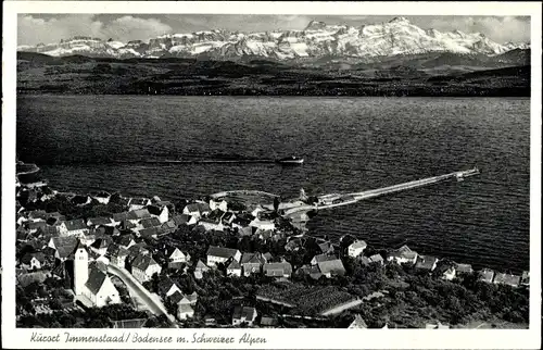 Ak Immenstaad am Bodensee, Ort aus Vogelschau gesehen mit Schweizer Alpen