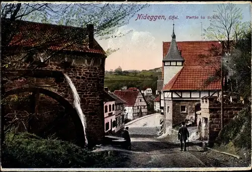 Ak Brück Nideggen in der Eifel, Straßenpartie, Wasserrad, Wassermühle