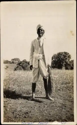 Foto Asien, Mann mit Turban und Reisigbündel